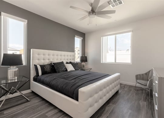 Primary bedroom with upholstered bed in Centennial North Las Vegas rental home