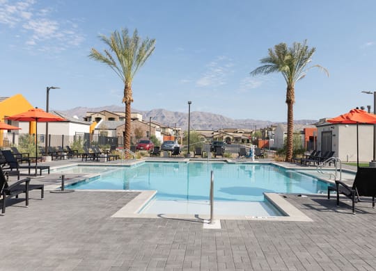 Resort-style pool with lounge seating in North Las Vegas rental community