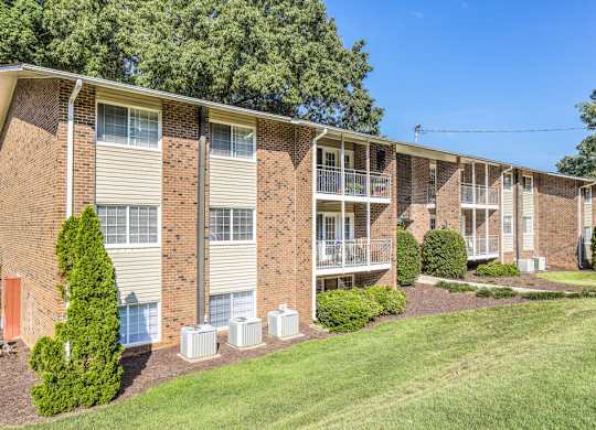 Apartment building exterior featuring modern architecture at Grand Arbor Reserve Apartments in Raleigh, NC 27607, near Central Raleigh.