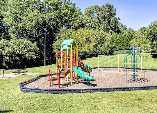 Playground with safe play equipment at Grand Arbor Reserve Apartments in Raleigh, NC 27607, near Central Raleigh.