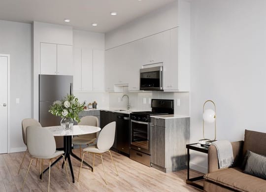 a kitchen and dining room with a table and chairs