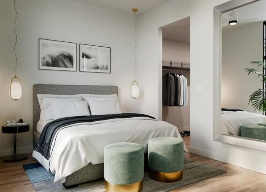 a bedroom with a bed and a mirror