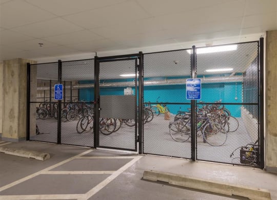 a group of bikes parked in a parking garage