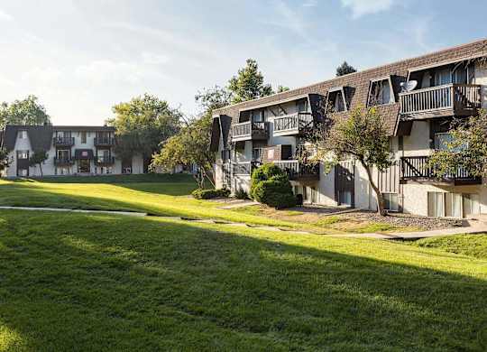 Exterior view of Trailgrove Apartments in Denver with classic architecture and well-maintained landscaping.