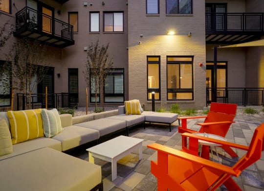 an outdoor lounge space at The Parallel apartments