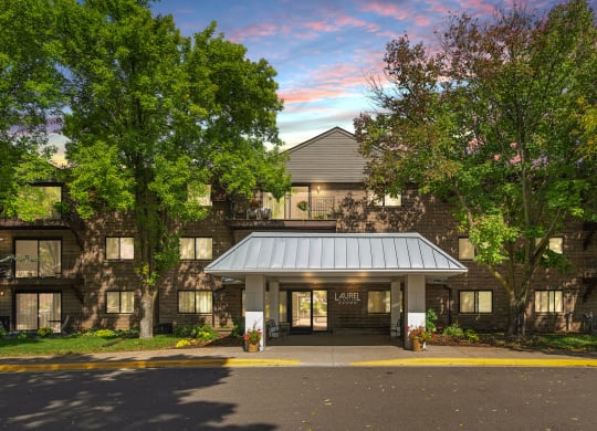 Laurel West End Apartments in Golden Valley, MN photo of a large building with trees in front of it
