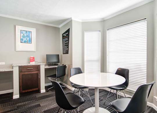 Business center with workstations and computers at Place at Midway apartments in Douglasville near Lithia Springs, GA