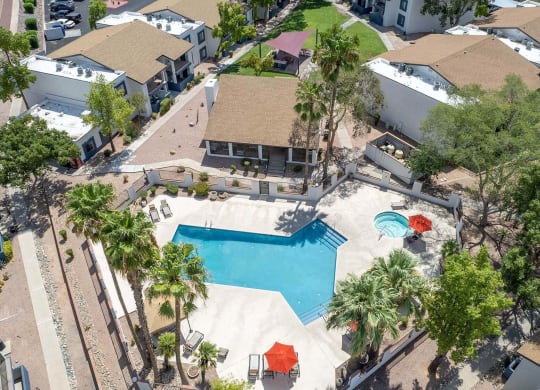 a aerial view of a swimming pool and a house