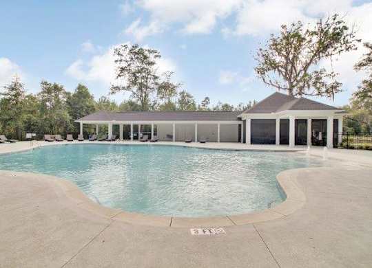 Omnia at Richmond Hill Townhomes in Georgia photo of a large pool with a building in the background