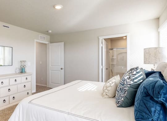a bedroom with a bed and a dresser