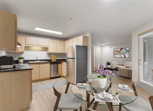 A modern kitchen with a dining table set for two.