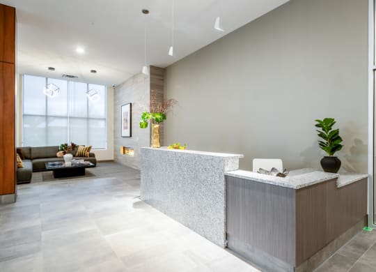 a lobby with a reception desk and a couch