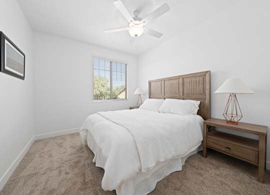 Townhomes in Surprise, AZ with In-Unit Washer and Dryer - Sierra Verde - Bedroom with Plush Carpeting, Double Nightstands, and Wall Art