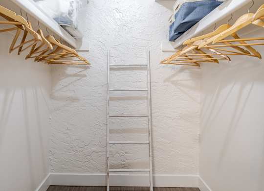 Spacious closet with built-in shelving inside a Sono Tempe apartment in Tempe, Arizona.