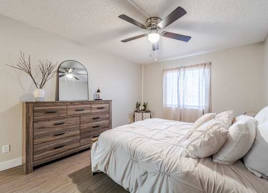 Bedroom inside a Sono Tempe apartment home in Tempe, AZ with neutral finishes and natural light.