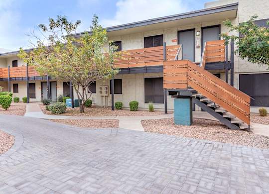 Exterior view of Sono Tempe, a pet-friendly apartment community in Tempe near downtown Tempe, AZ, showcasing modern architecture and landscaped grounds.