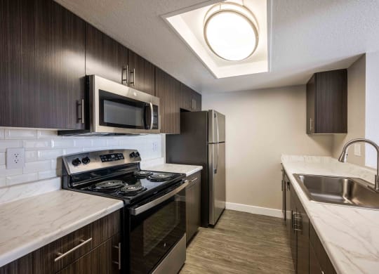 modern kitchen with stainless steel appliances in a home