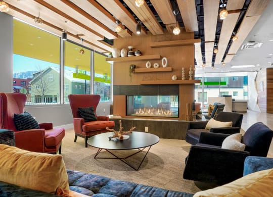 a living room filled with furniture and a fire place