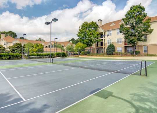 Illuminated tennis courts at Grande Club apartments in Duluth, GA 30096, near Lawrenceville.