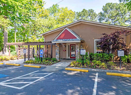 Outdoor leasing office area with parking lot at Stratford Ridge, a pet-friendly community in Marietta, GA, near Smyrna.