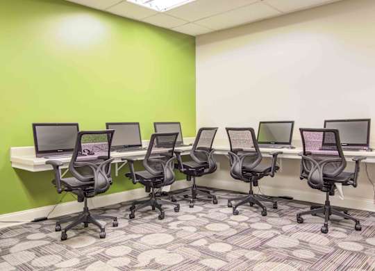 On-site business center with computers, printer access, and workspace at Stratford Ridge Apartments in Marietta, GA—ideal for remote work and study.
