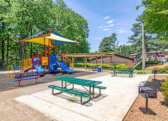 Community playground with kid-friendly equipment at Stratford Ridge Apartments in Marietta, GA—perfect for families in this pet-friendly apartment community.
