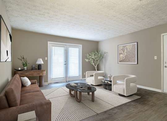 Spacious living room with sleek wood-style plank flooring at Stratford Ridge, a pet-friendly community in Marietta, GA, near Smyrna.