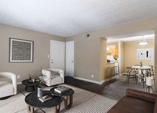 Spacious living room with natural light and comfortable seating in a pet-friendly home at Stratford Ridge Apartments in Marietta, GA.