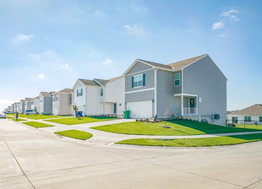 a row of houses on the side of a street