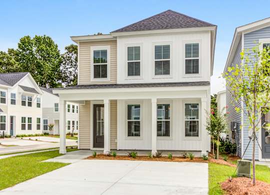 Townhouses for Rent in Park Circle SC - Sumner Village - Exterior View of Townhome with Private Driveway and Lush Landscaping