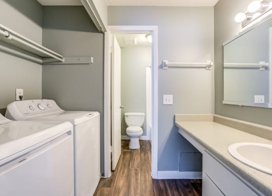 The Commons Apartments in Tampa Florida photo of a bathroom with a washer and dryer