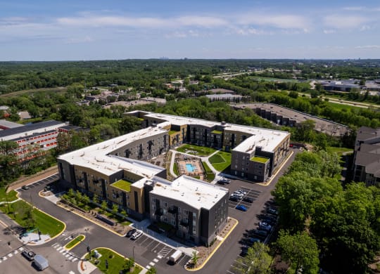 an aerial view of an office building and a parking lot