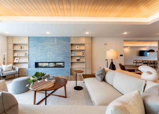 a living room with a couch and a fireplace