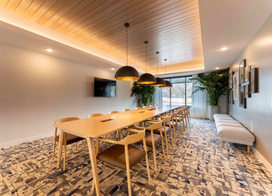 a conference room with a long table and chairs