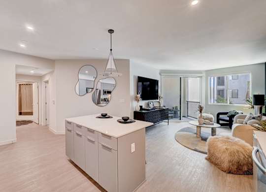 A modern kitchen with a white countertop and a large island.