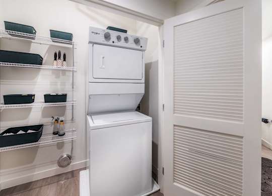 A white oven and dishwasher are in a small kitchen.