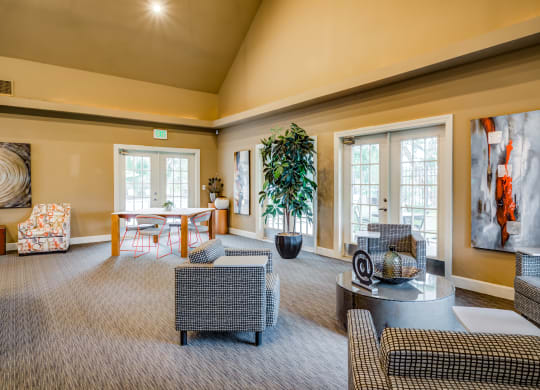 a large living room with couches and chairs