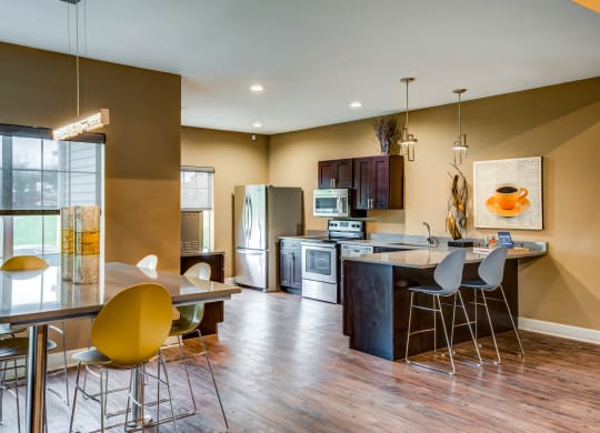 a kitchen and dining area in the club house