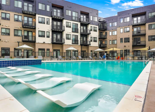 Apartments for Rent in Wheat Ridge - Parallel - Resort-Style Pool with In-Water Loungers, Deskside Lounge Chairs, and Spa