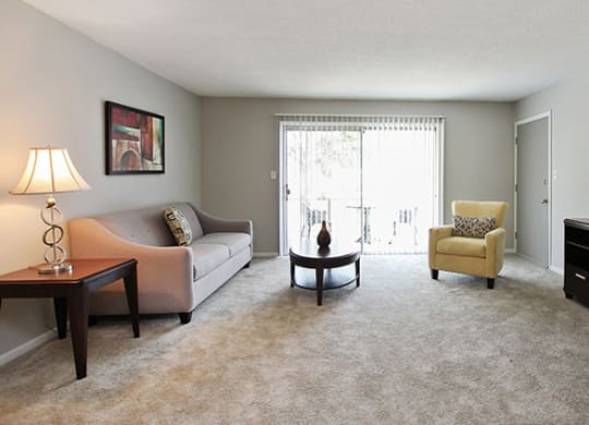 Pet-Friendly Apartments in Atlanta, GA – Estuary –a living room with a couch and a table