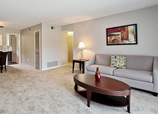 Pet-Friendly Apartments in Atlanta, GA – Estuary –a living room with a couch and a table