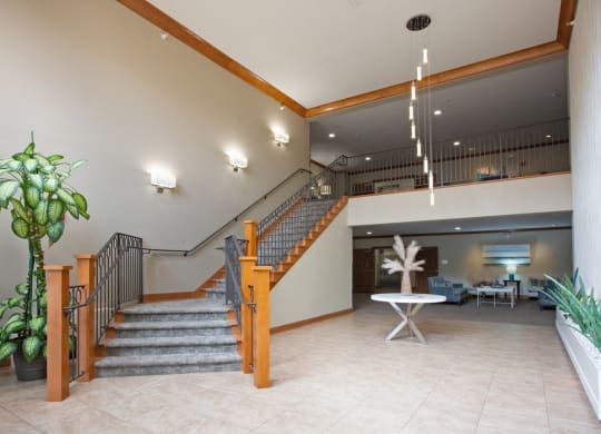 Laurel East End Apartments in Golden Valley, MN photo of the lobby of a building with a staircase and a potted plant