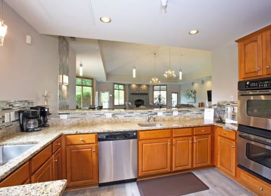 Laurel East End Apartments in Golden Valley, MN photo of a large kitchen with granite counter tops and stainless steel appliances