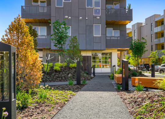 Exterior view of the front of Meredith House with a walkway and landscaping