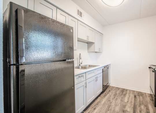 Kitchen with black appliances at Townsend Apartments in Jacksonville near Atlantic Beach, Florida.