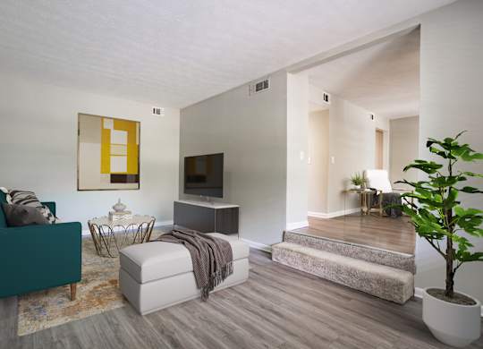 Spacious living room with hardwood-style flooring at Townsend Apartments in Jacksonville near Atlantic Beach, Florida.