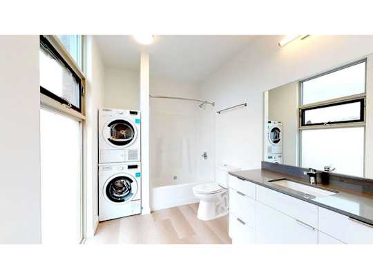 Bathroom with washer and dryer