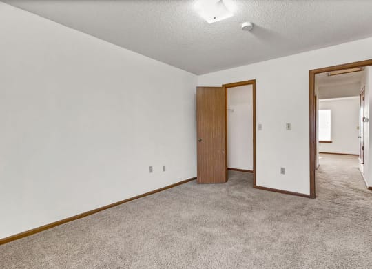 carpeted bedroom with closet and overhead light