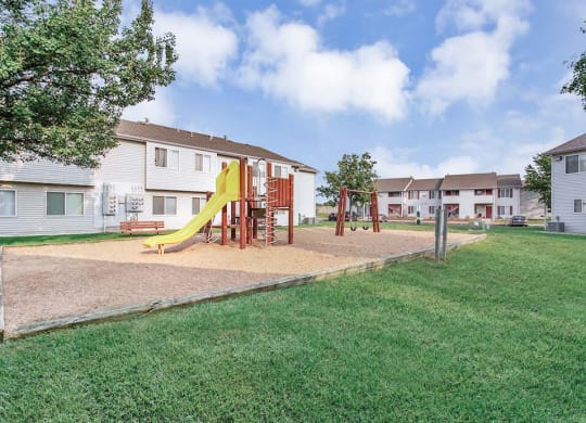 playground with grassy area at northridge crossing apartments