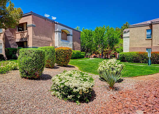 A well-maintained garden in front of a building.